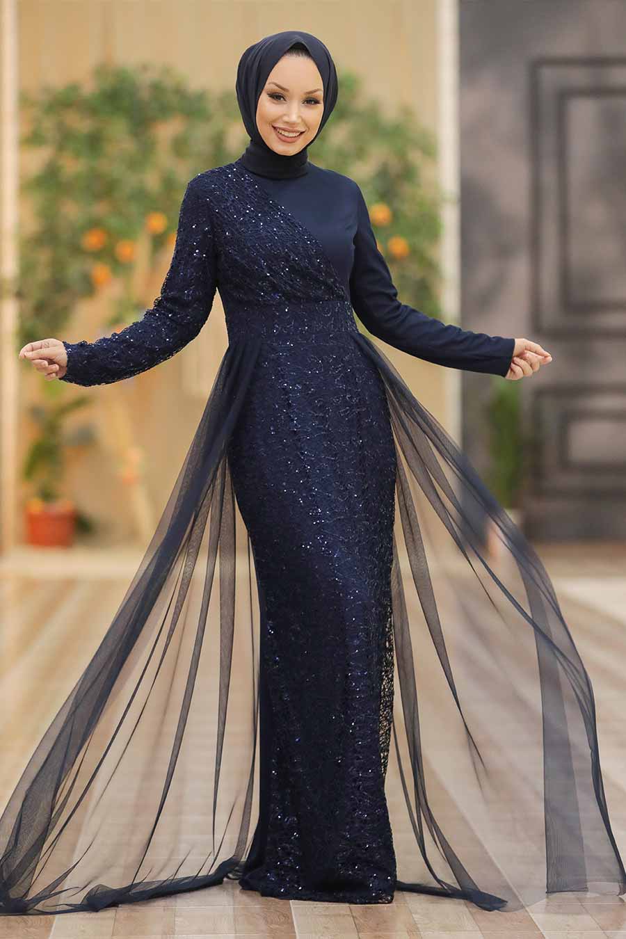 Elegant navy blue sequined Hayati gown with chiffon overlay and tulle train