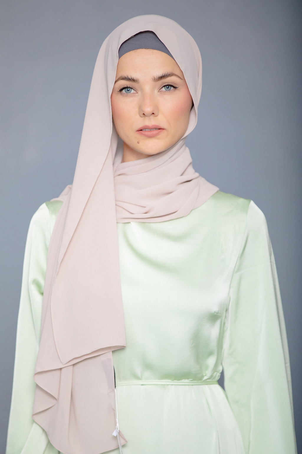 Woman in Latte Chiffon Hijab and light green dress