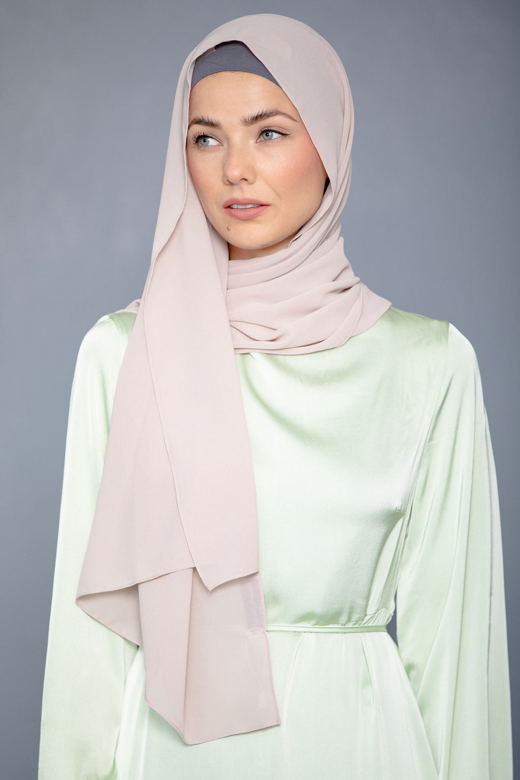 Woman in light pink Latte Chiffon Hijab and light green dress