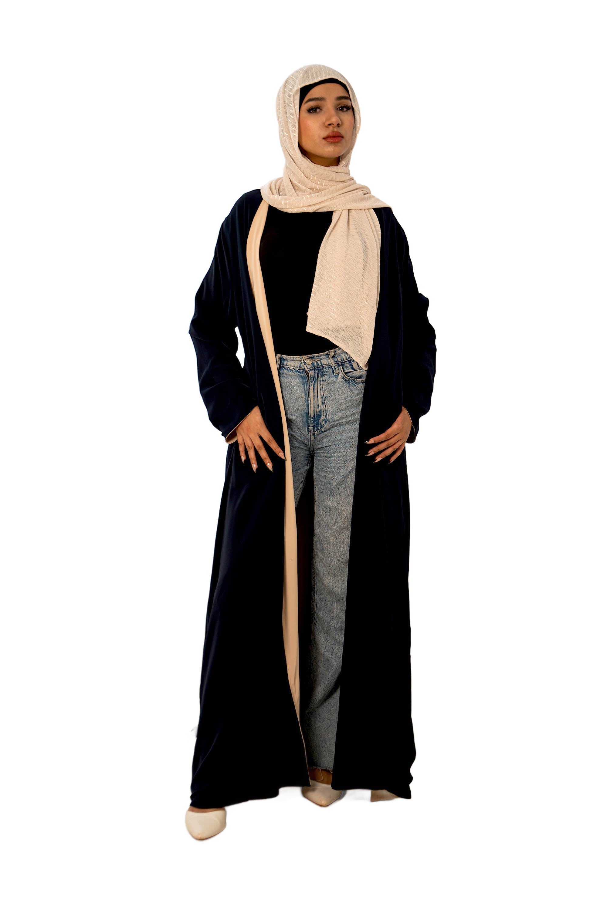 Woman in reversible navy cream open abaya with beige hijab