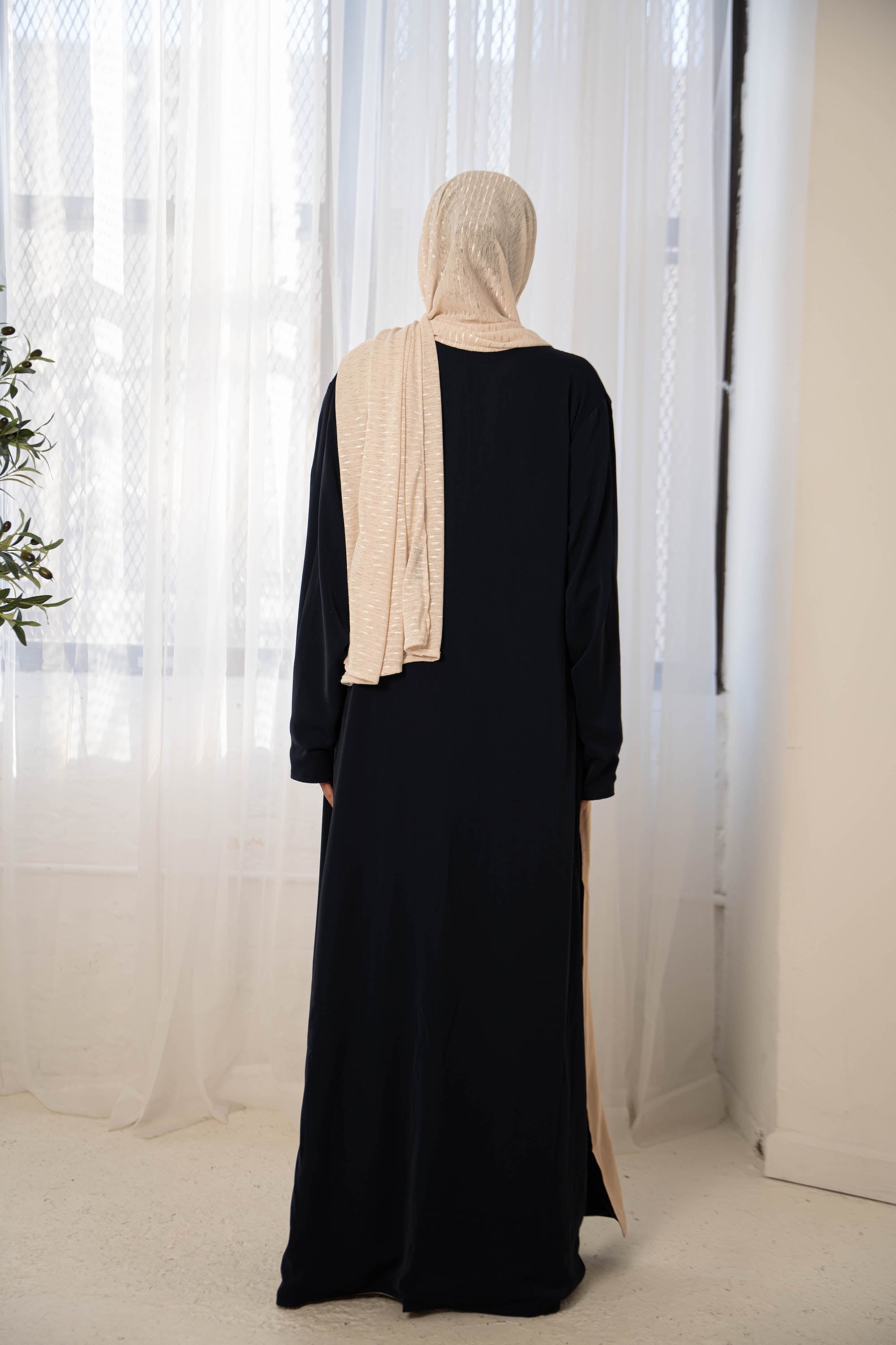 Black abaya with beige hijab in navy cream reversible open style