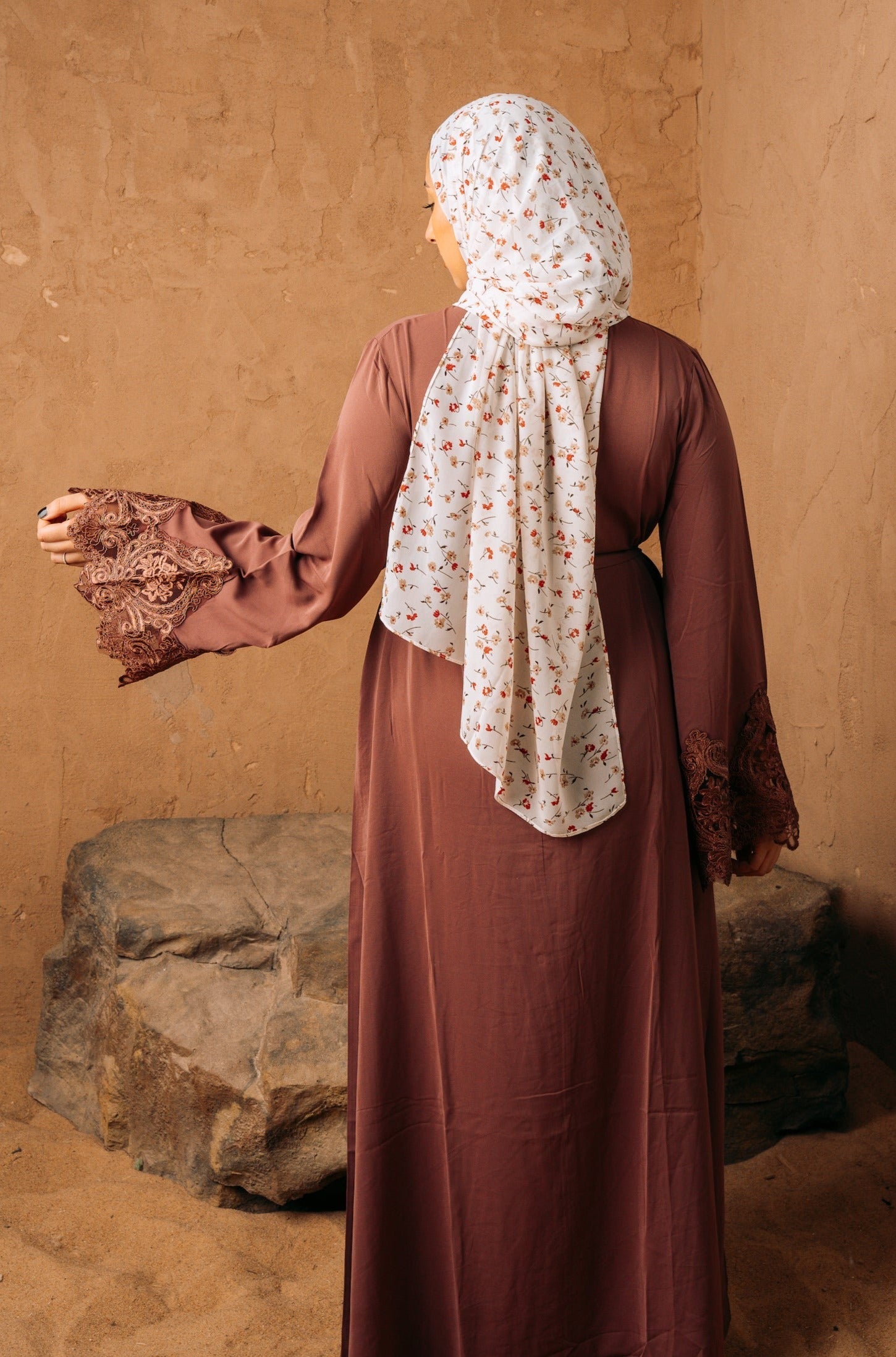 Woman in brown dress and floral hijab wearing purple lace sleeve abaya
