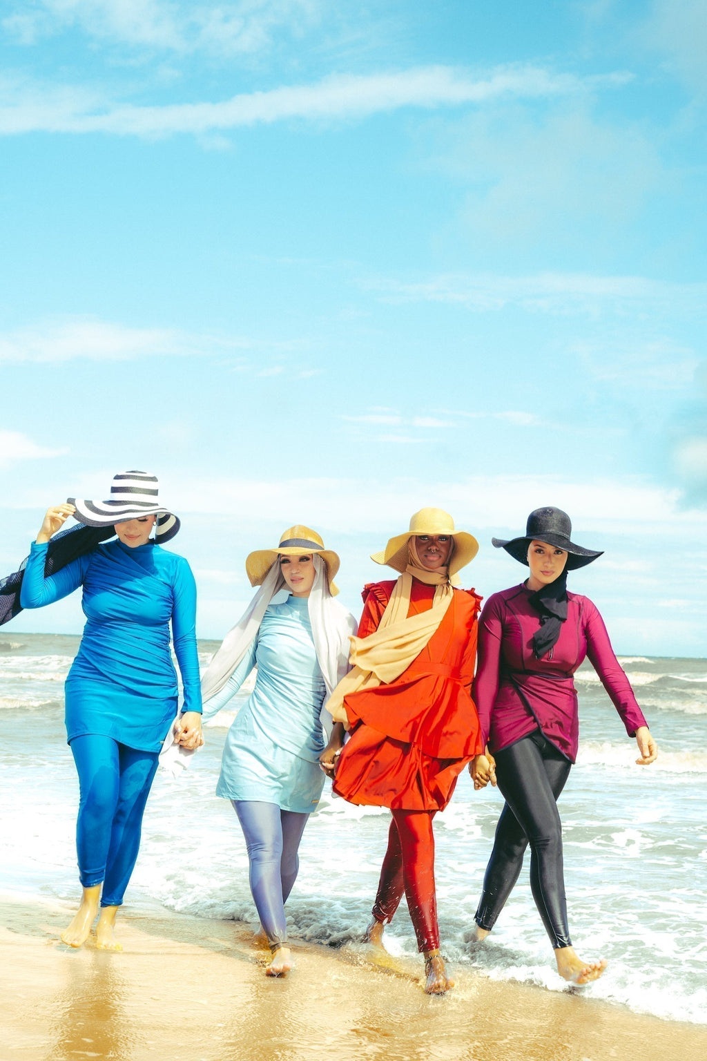 Four women in ruched 3-piece modest burkini swimsuit