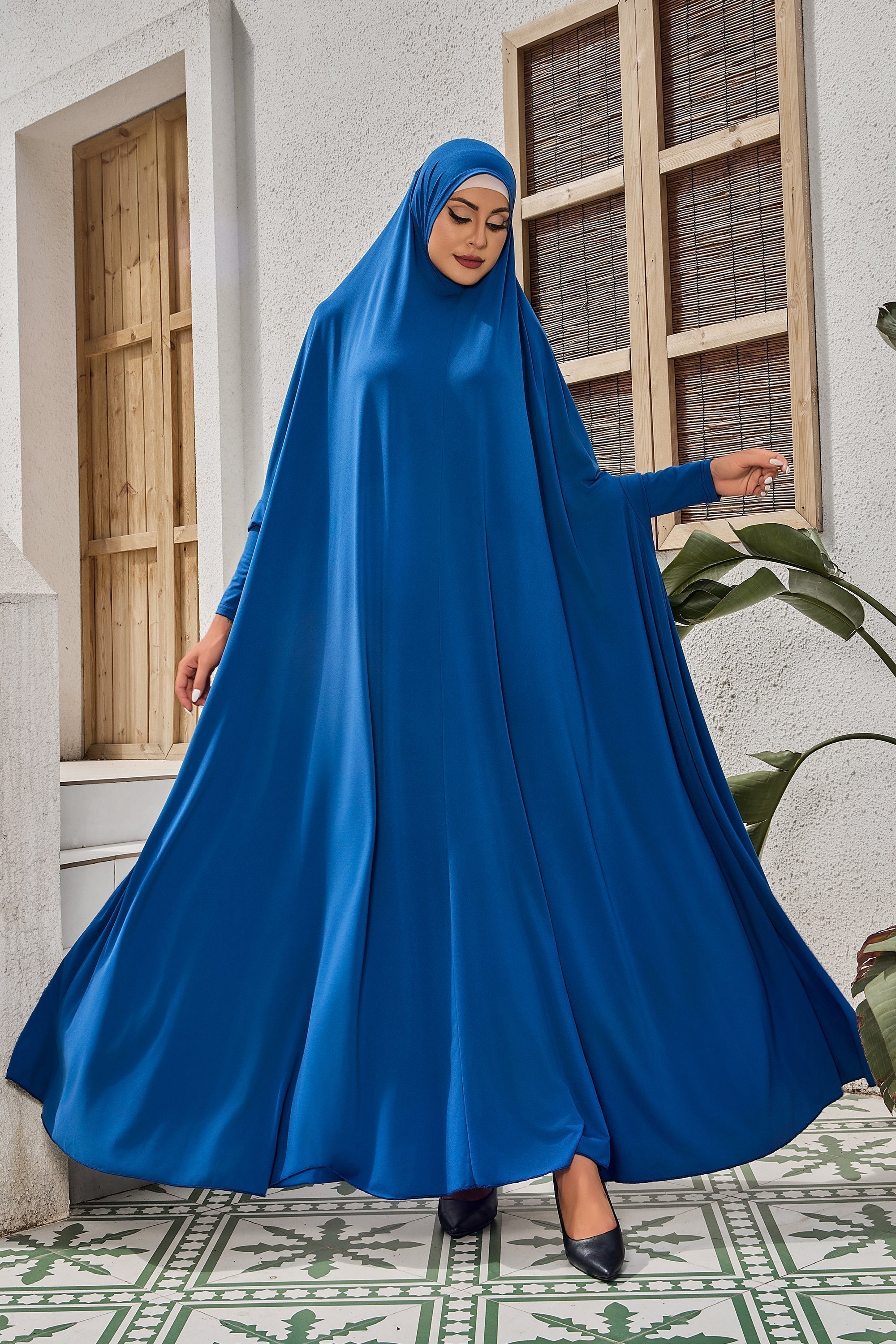 Teal long-sleeved modest dress with head covering for salah prayer